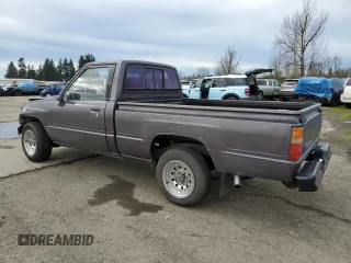 1988 Toyota Pickup z VIN JT4RN50R1J5149025, wystawiony jako Copart lot #41651215 z przebiegiem 263 997 mil mil oraz Szkoda całkowita • Salvage title. Historia ofert i sprzedaży dostępna na DreamBid. Obrazek 2.