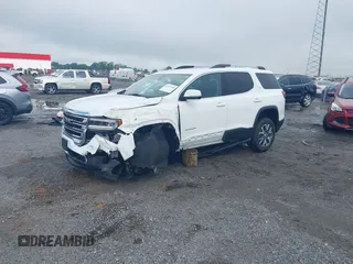 2023 GMC Acadia SLT with VIN 1GKKNML4XPZ156685, listed as a IAAI auction lot 42231988 with 61,094 mi miles and . Bid and sale history available at DreamBid. Image 2.