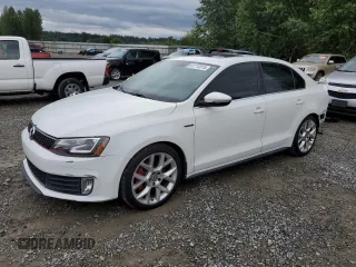2014 Volkswagen Jetta GLI with VIN 3VW4T7AJ6EM266410, listed as a Copart auction lot 61713315 with 102,169 mi miles and Salvage title. Bid and sale history available at DreamBid. Image 1.