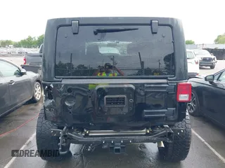 2015 Jeep Wrangler Unlimited Willys Wheeler with VIN 1C4BJWDG4FL687829, listed as a IAAI auction lot 42099147 with 98,969 mi miles and . Bid and sale history available at DreamBid. Image 17.