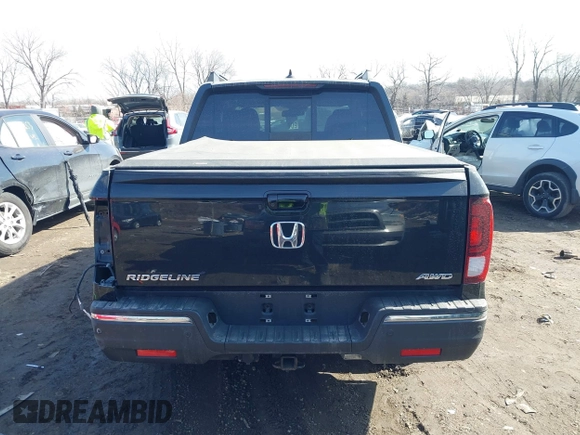 2019 Honda Ridgeline RTL-E with VIN 5FPYK3F7XKB014406, listed as a IAAI auction lot 41765154 with 65,209 mi miles and . Bid and sale history available at DreamBid. Image 17.