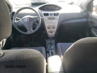 2010 Toyota Yaris with VIN JTDBT4K33A1387279, listed as a Copart auction lot 51213405 with Not Provided miles and Salvage Title. Bid and sale history available at DreamBid. Image 8.