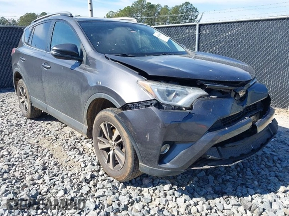 2018 Toyota RAV4 XLE with VIN 2T3WFREV2JW450019, listed as a IAAI auction lot 41704084 with 257,737 mi miles. Bid and sale history available at carsss.com. Image 1.