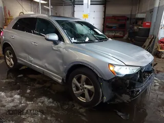 2019 Audi Q3 Premium with VIN WA1AECF33K1077204, listed as a IAAI auction lot 41538374 with 101,264 mi miles. Bid and sale history available at carsss.com. Image 1.