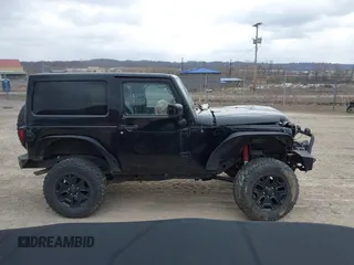 2014 Jeep Wrangler Sahara with VIN 1C4AJWBG9EL311477, listed as a IAAI auction lot 41884255 with 82,221 mi miles and . Bid and sale history available at carsss.com. Image 14.