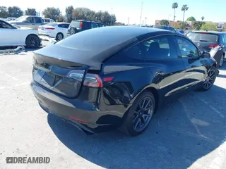 2019 Tesla Model 3 Mid Range with VIN 5YJ3E1EA5KF306816, listed as a IAAI auction lot 41710916 with 76,222 mi miles. Bid and sale history available at carsss.com. Image 4.