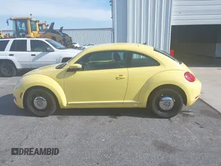 2013 Volkswagen Beetle 2.5L with VIN 3VWHX7AT7DM613197, listed as a IAAI auction lot 41298890 with 130,219 mi miles and . Bid and sale history available at DreamBid. Image 14.