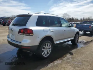 2010 Volkswagen Touareg VR6 with VIN WVGBF7A97AD004355, listed as a Copart auction lot 52861335 with 129,454 mi miles and Salvage Title. Bid and sale history available at DreamBid. Image 3.