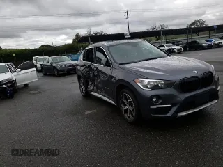 2018 BMW X1 xDrive28i with VIN WBXHT3C33J5K23187, listed as a Copart auction lot 71063192 with 97,403 mi miles. Bid and sale history available at carsss.com. Image 10.