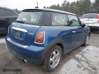 2009 MINI Cooper Hardtop with VIN WMWMF33579TW72543, listed as a IAAI auction lot 41844387 with 125,835 mi miles. Bid and sale history available at carsss.com. Image 4.
