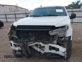 2019 Ford F-150 XL with VIN 1FTEW1E45KKE21872, listed as a IAAI auction lot 40704365 with 112,221 mi miles and . Bid and sale history available at DreamBid. Image 6.