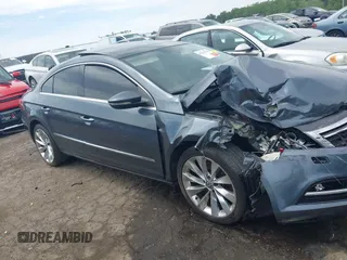 2013 Volkswagen CC Executive z VIN WVWGU7AN8DE520610, wystawiony jako IAAI lot #42278719 z przebiegiem 197 905 mil mil oraz . Historia ofert i sprzedaży dostępna na DreamBid. Obrazek 13.