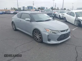 2014 Scion tC with VIN JTKJF5C71E3077886, listed as a IAAI auction lot 41939128 with 138,845 mi miles. Bid and sale history available at carsss.com. Image 1.
