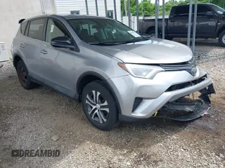 2018 Toyota RAV4 LE z VIN 2T3BFREV1JW716127, wystawiony jako IAAI lot #42312537 z przebiegiem 126 324 mil mil oraz . Historia ofert i sprzedaży dostępna na DreamBid. Obrazek 1.