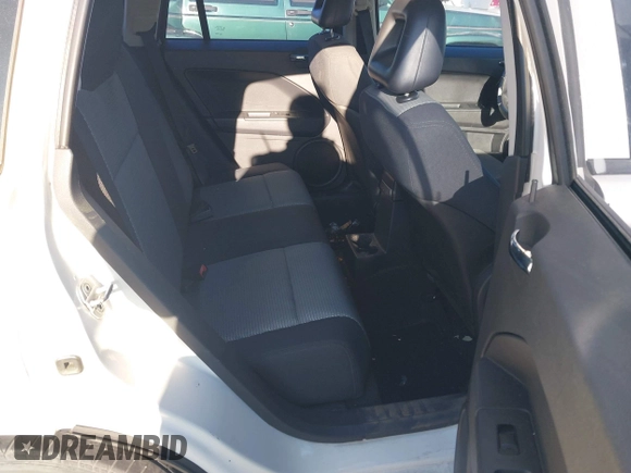 2009 Dodge Caliber SXT with VIN 1B3HB48A39D233105, listed as a IAAI auction lot 41872576 with Not Provided miles and . Bid and sale history available at DreamBid. Image 8.