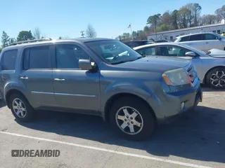 2010 Honda Pilot Touring with VIN 5FNYF4H94AB031167, listed as a IAAI auction lot 41800738 with 184,126 mi miles and . Bid and sale history available at carsss.com. Image 13.