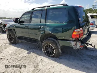 2000 Toyota Land Cruiser with VIN JT3HT05J8Y0085990, listed as a Copart auction lot 76706864 with 329,562 mi miles and Salvage Title. Bid and sale history available at carsss.com. Image 2.