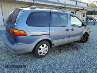 1999 Toyota Sienna LE with VIN 4T3ZF13C8XU108650, listed as a Copart auction lot 74476004 with 215,060 mi miles and Salvage Title. Bid and sale history available at carsss.com. Image 3.