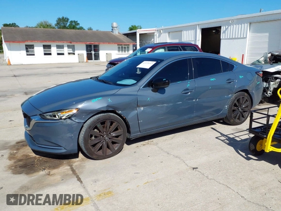 2021 Mazda 6 Carbon Edition with VIN JM1GL1WY4M1619533, listed as a IAAI auction lot 41979213 with 84,783 mi miles and . Bid and sale history available at DreamBid. Image 2.