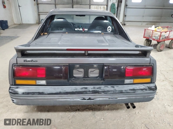1989 Toyota MR2 z VIN JT2AW15C1K0150268, wystawiony jako Copart lot #86257134 z przebiegiem 93 969 mil mil oraz Tytuł czysty. Historia ofert i sprzedaży dostępna na DreamBid. Obrazek 6.