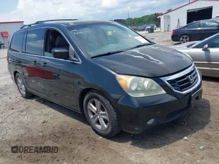 2010 Honda Odyssey Touring with VIN 5FNRL3H99AB056282, listed as a IAAI auction lot 42518695 with 179,456 mi miles and . Bid and sale history available at DreamBid. Image 1.