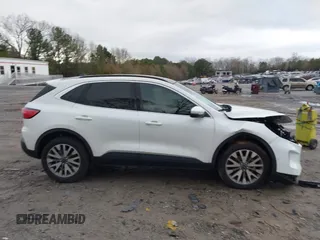 2020 Ford Escape Titanium Hybrid with VIN 1FMCU9DZ0LUC56274, listed as a IAAI auction lot 41256530 with 43,502 mi miles and . Bid and sale history available at DreamBid. Image 14.
