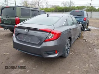 2017 Honda Civic EX-T with VIN 19XFC1F34HE014334, listed as a IAAI auction lot 42009311 with 124,717 mi miles. Bid and sale history available at carsss.com. Image 4.