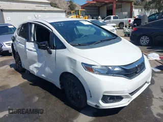 2019 Honda Fit LX z VIN 3HGGK5H4XKM703328, wystawiony jako IAAI lot #42384071 z przebiegiem 70 764 mil mil oraz . Historia ofert i sprzedaży dostępna na DreamBid. Obrazek 1.