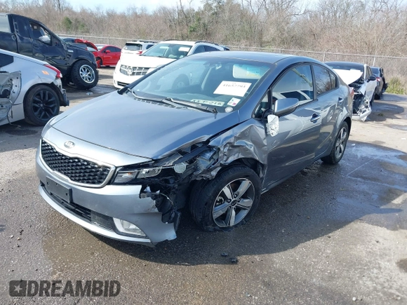 2018 Kia Forte LX with VIN 3KPFL4A79JE194864, listed as a IAAI auction lot 41657793 with 128,256 mi miles and . Bid and sale history available at DreamBid. Image 2.