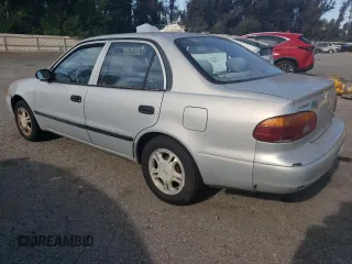 2001 Chevrolet Prizm z VIN 1Y1SK52811Z447352, wystawiony jako Copart lot #73916394 z przebiegiem 89 265 mil mil oraz Szkody całkowita. Historia ofert i sprzedaży dostępna na DreamBid. Obrazek 2.