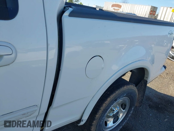 2003 Ford F-150 XLT with VIN 1FTRW08633KD11896, listed as a IAAI auction lot 42137360 with 118,654 mi miles. Bid and sale history available at carsss.com. Image 12.