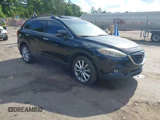 2015 Mazda CX-9 Grand Touring z VIN JM3TB2DA4F0464186, wystawiony jako IAAI lot #42227595 z przebiegiem 124 526 mil mil oraz . Historia ofert i sprzedaży dostępna na DreamBid. Obrazek 1.