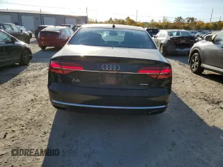 2015 Audi A8 z VIN WAUJGAFD7FN032176, wystawiony jako Copart lot #76943904 z przebiegiem 126 423 mil mil oraz Czysty tytuł • Clean title. Historia ofert i sprzedaży dostępna na DreamBid. Obrazek 6.