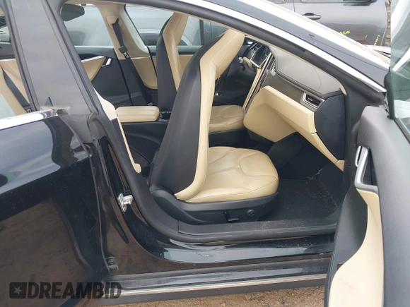 2014 Tesla Model S 60 with VIN 5YJSA1H10EFP34137, listed as a IAAI auction lot 42311565 with Not provided miles and . Bid and sale history available at DreamBid. Image 5.