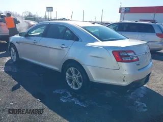2013 Ford Taurus SEL with VIN 1FAHP2E8XDG164903, listed as a IAAI auction lot 41580690 with 163,128 mi miles and . Bid and sale history available at carsss.com. Image 3.