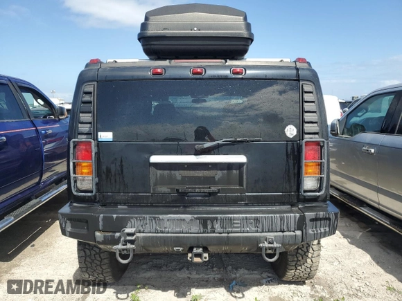 2003 Hummer H2 with VIN 5GRGN23U33H114427, listed as a Copart auction lot 76528834 with 133,571 mi miles and Salvage Title. Bid and sale history available at carsss.com. Image 6.