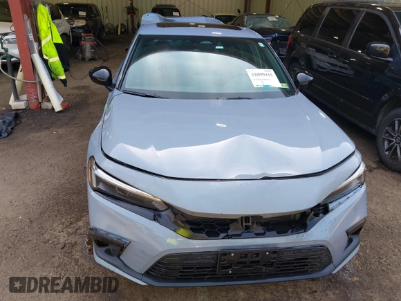 2022 Honda Civic Si with VIN 2HGFE1E52NH474042, listed as a IAAI auction lot 42099415 with 26,828 mi miles and . Bid and sale history available at DreamBid. Image 12.