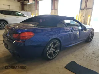 2015 BMW M6 z VIN WBSLZ9C54FD651463, wystawiony jako Copart lot #50922005 z przebiegiem Nie podano mil oraz Szkoda całkowita • Salvage title. Historia ofert i sprzedaży dostępna na DreamBid. Obrazek 3.