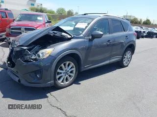 2014 Mazda CX-5 Grand Touring with VIN JM3KE4DY8E0391317, listed as a IAAI auction lot 41871641 with 77,048 mi miles. Bid and sale history available at carsss.com. Image 2.