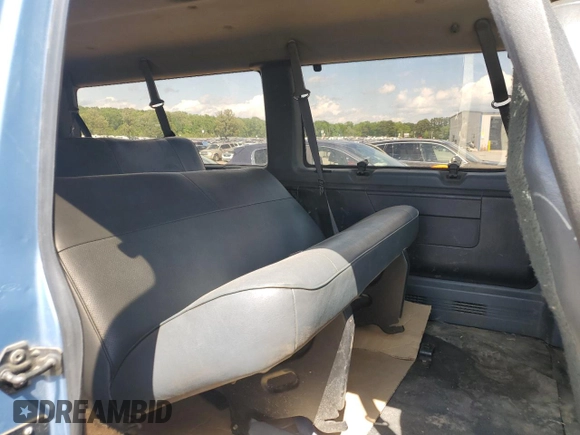 1994 Ford Econoline Wagon Super Custom z VIN 1FBJS31H3RHB19765, wystawiony jako Copart lot #55384275 z przebiegiem 196 656 mil mil oraz Tytuł czysty. Historia ofert i sprzedaży dostępna na DreamBid. Obrazek 11.