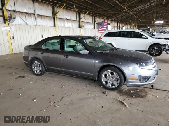 2010 Ford Fusion SE with VIN 3FAHP0HA2AR320858, listed as a Copart auction lot 52054045 with 151,943 mi miles and Salvage Title. Bid and sale history available at DreamBid. Image 4.