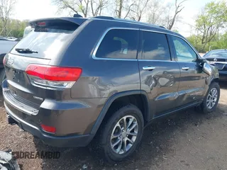 2014 Jeep Grand Cherokee Limited with VIN 1C4RJFBT4EC349957, listed as a IAAI auction lot 42118241 with 127,168 mi miles and . Bid and sale history available at DreamBid. Image 4.