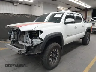 2022 Toyota Tacoma SR with VIN 3TMCZ5AN5NM480311, listed as a IAAI auction lot 42542600 with 43,297 mi miles and . Bid and sale history available at DreamBid. Image 2.