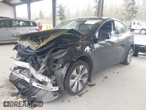 2023 Tesla Model Y Long Range with VIN 7SAYGDEE0PF909610, listed as a IAAI auction lot 41906081 with 20,656 mi miles and . Bid and sale history available at DreamBid. Image 18.