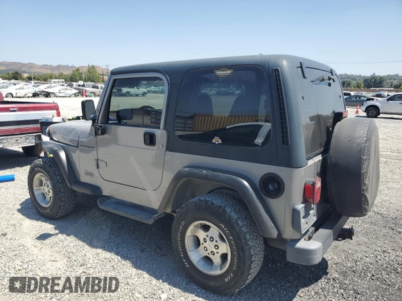 2000 Jeep Wrangler SE with VIN 1J4FA29P7YP737289, listed as a Copart auction lot 61869865 with 91,097 mi miles and Salvage title. Bid and sale history available at DreamBid. Image 2.