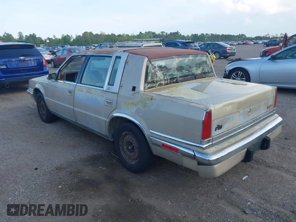1991 Chrysler New Yorker z VIN 1C3XY66R1MD290736, wystawiony jako IAAI lot #41932377 z przebiegiem 176 868 mil mil oraz . Historia ofert i sprzedaży dostępna na DreamBid. Obrazek 3.