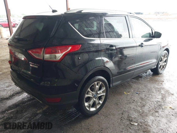 2014 Ford Escape Titanium z VIN 1FMCU0J96EUA84108, wystawiony jako IAAI lot #42114002 z przebiegiem 176 735 mil mil oraz . Historia ofert i sprzedaży dostępna na DreamBid. Obrazek 4.