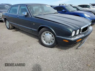 1999 Jaguar XJ with VIN SAJKX6047XC861227, listed as a Copart auction lot 75007414 with Not provided miles and Salvage title. Bid and sale history available at DreamBid. Image 4.