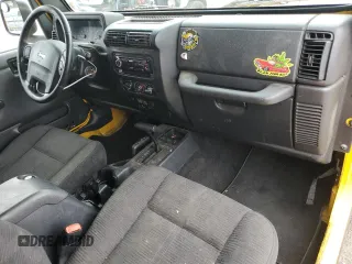 2004 Jeep Wrangler Rubicon with VIN 1J4FA69SX4P768963, listed as a Copart auction lot 56999665 with 91,949 mi miles and Salvage title. Bid and sale history available at DreamBid. Image 8.