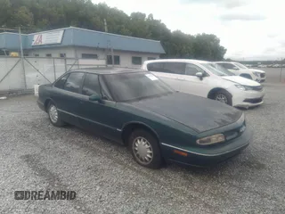 1998 Oldsmobile 88 LS z VIN 1G3HN52K5W4849011, wystawiony jako IAAI lot #42153650 z przebiegiem 171 969 mil mil oraz . Historia ofert i sprzedaży dostępna na DreamBid. Obrazek 1.